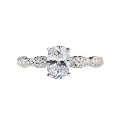 Four-Prong Oval-Cut Pavé-Set Diamond Ring
